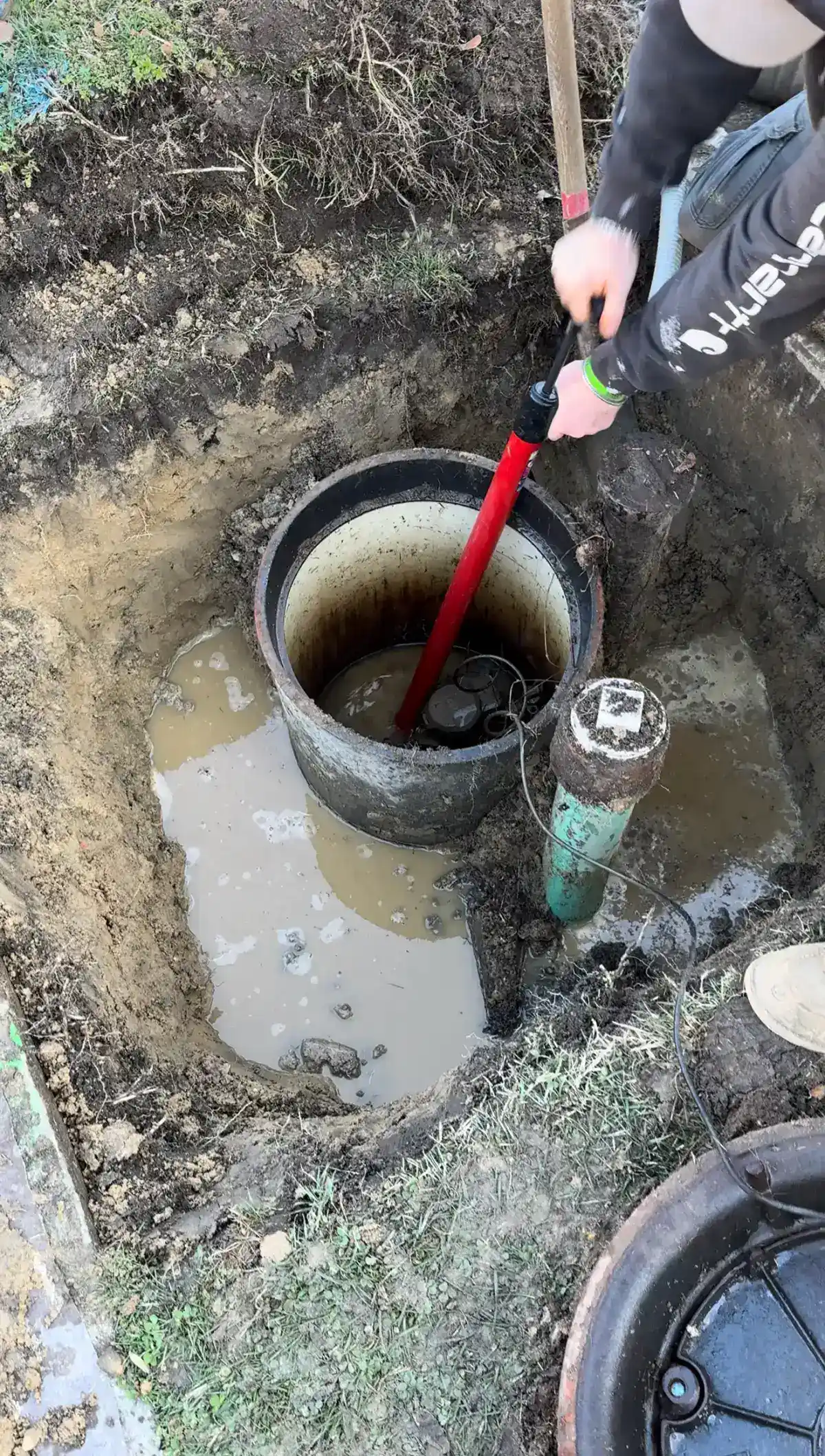 Technician repairing a sprinkler system backflow preventer valve