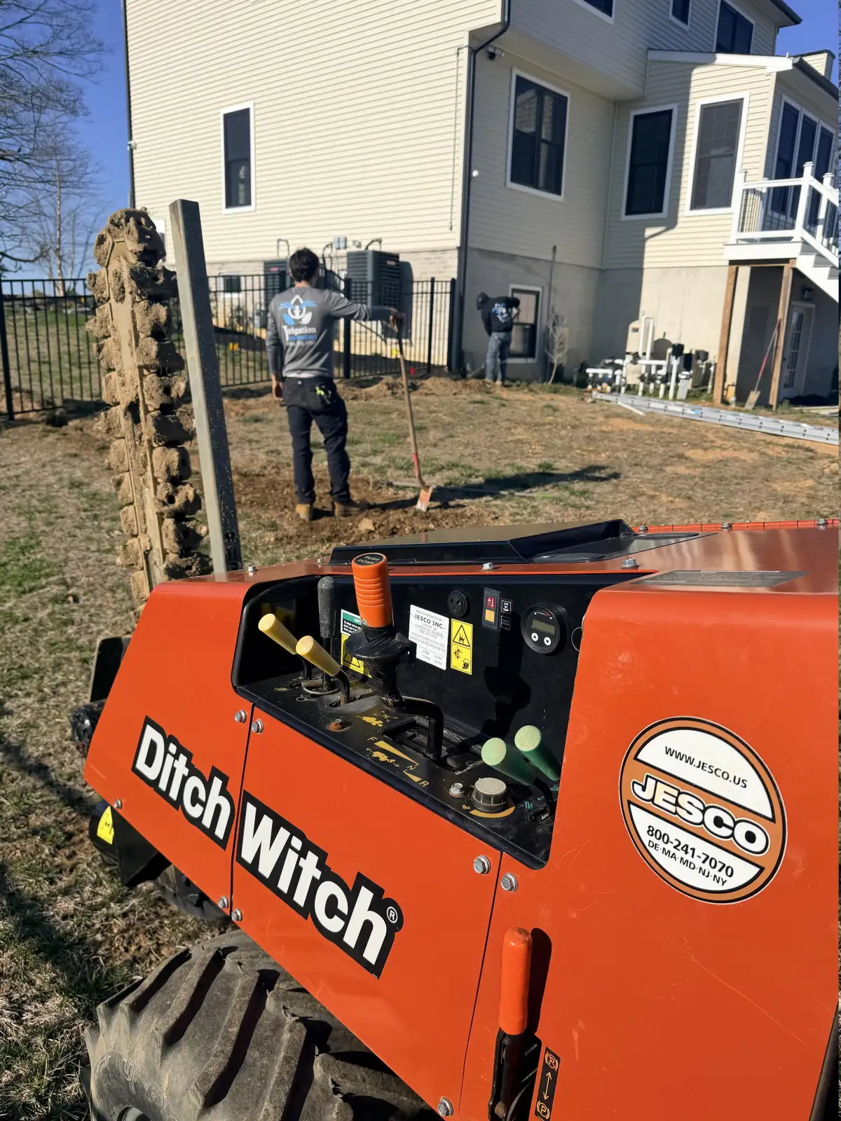 Irrigation Innovations crew using Ditch Witch trencher for installation