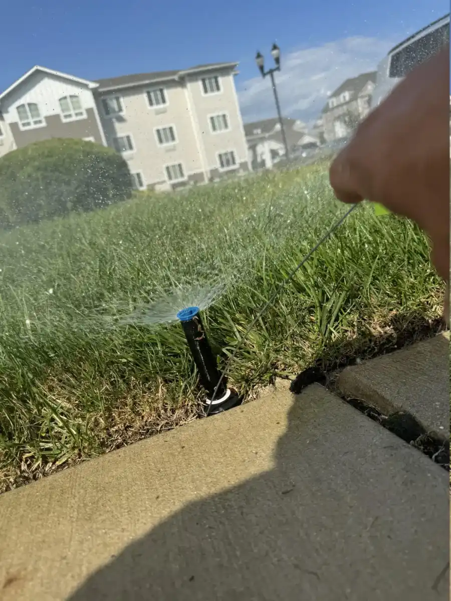 Sprinkler head adjustment for even lawn coverage