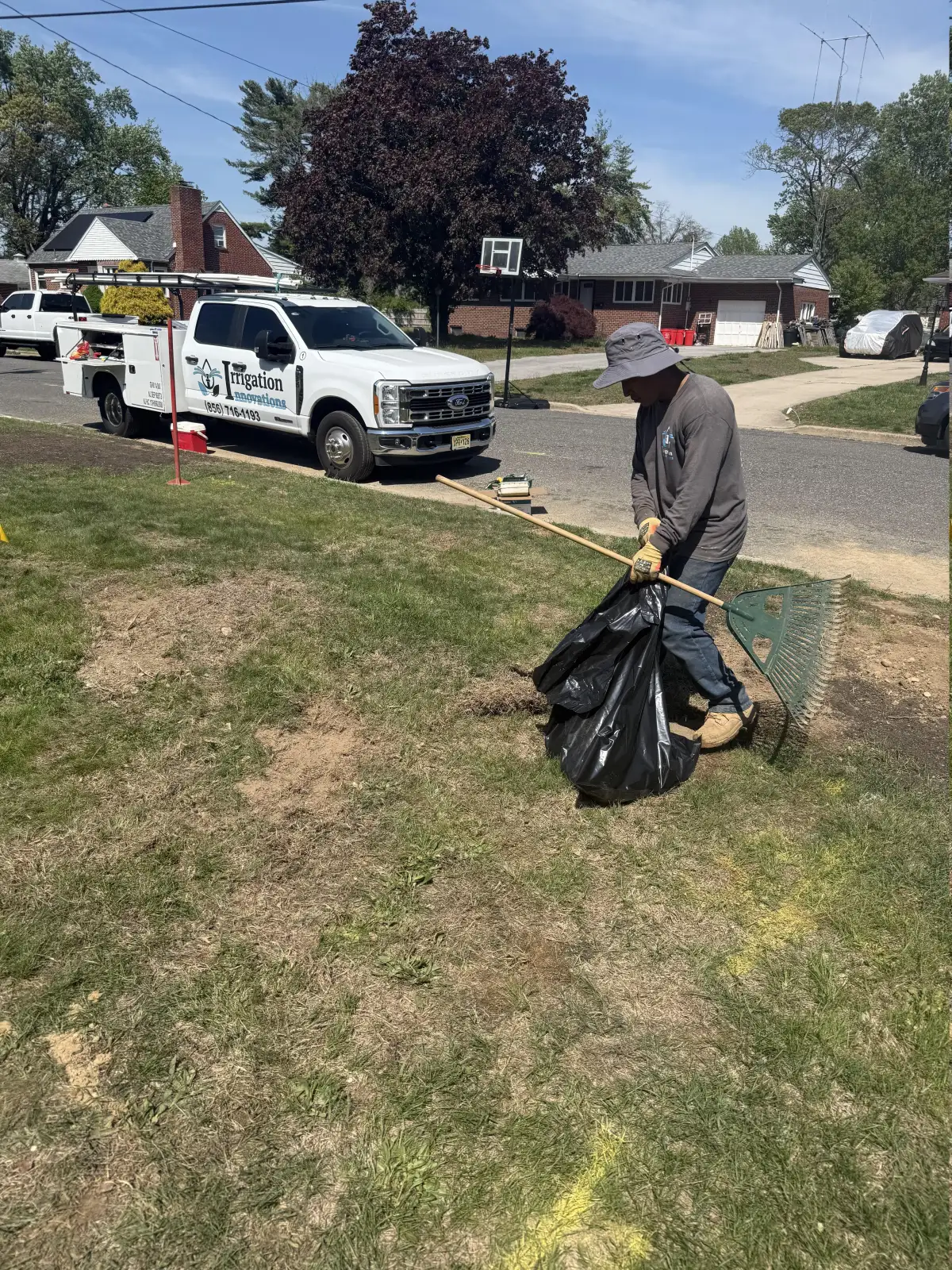 Irrigation Innovations crew member with branded service truck