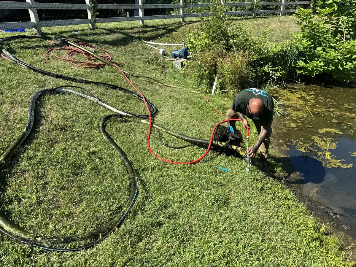 Well pump installation near pond for irrigation